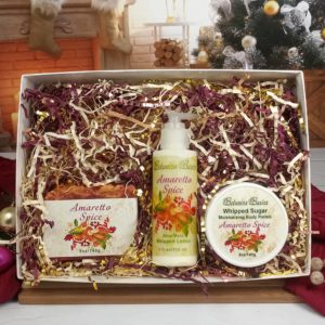 amaretto spice 3 piece gift set in open box with christmas tree background